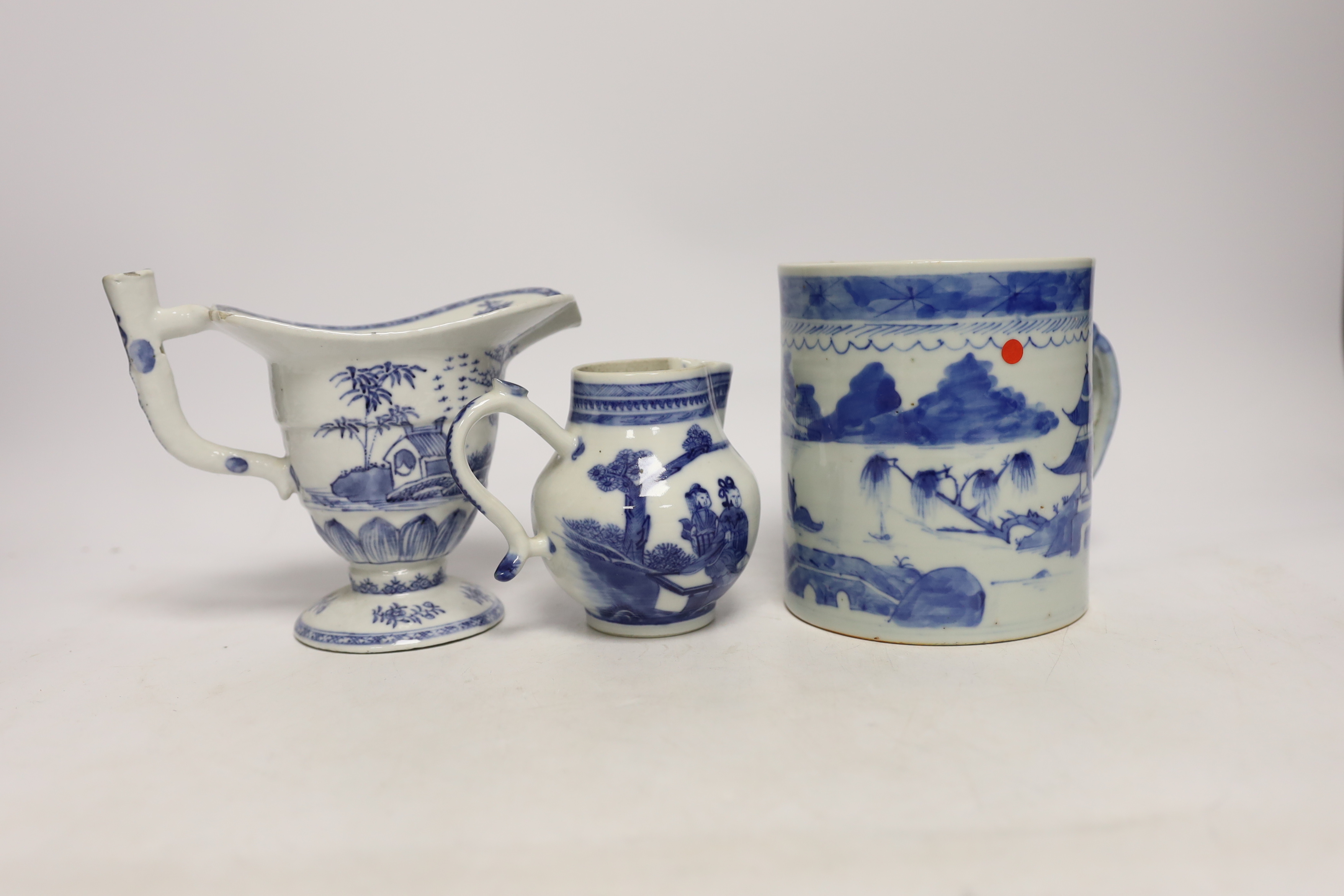 A Chinese blue and white mug and two jugs, 18th/19th century, largest 14cm high (3)